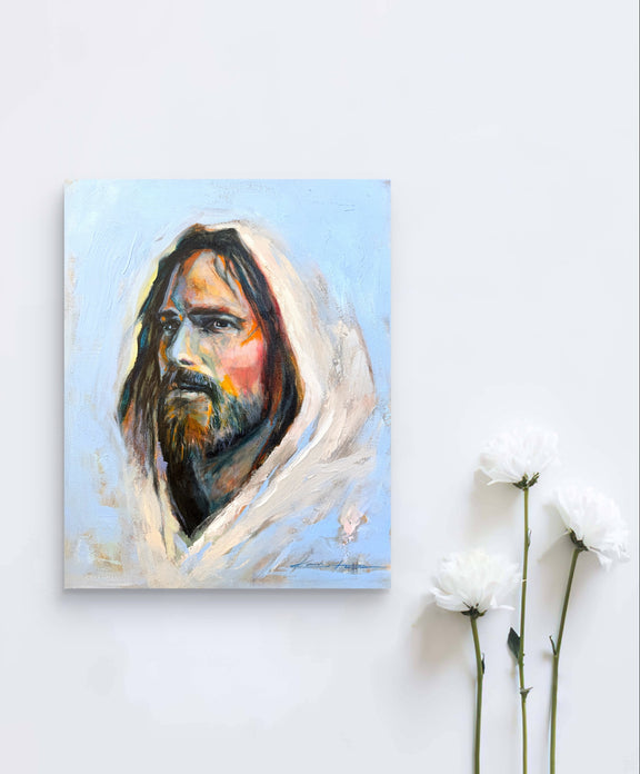 A beautiful image of Jesus painted in oil paint printed on Giclee paper. The perfect christian gift laying next to white flowers.