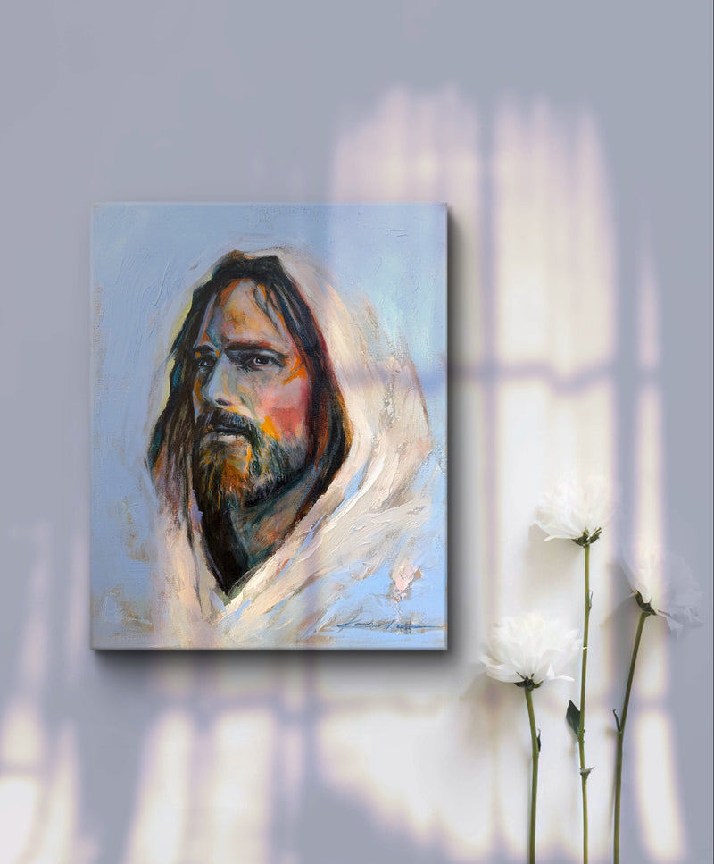 Jesus depicted in a moody blue atmosphere with rays of light shining through. The perfect christian art with a gallery wrapped canvas print hanging on a wall with with flowers in the lower right of the image. 
