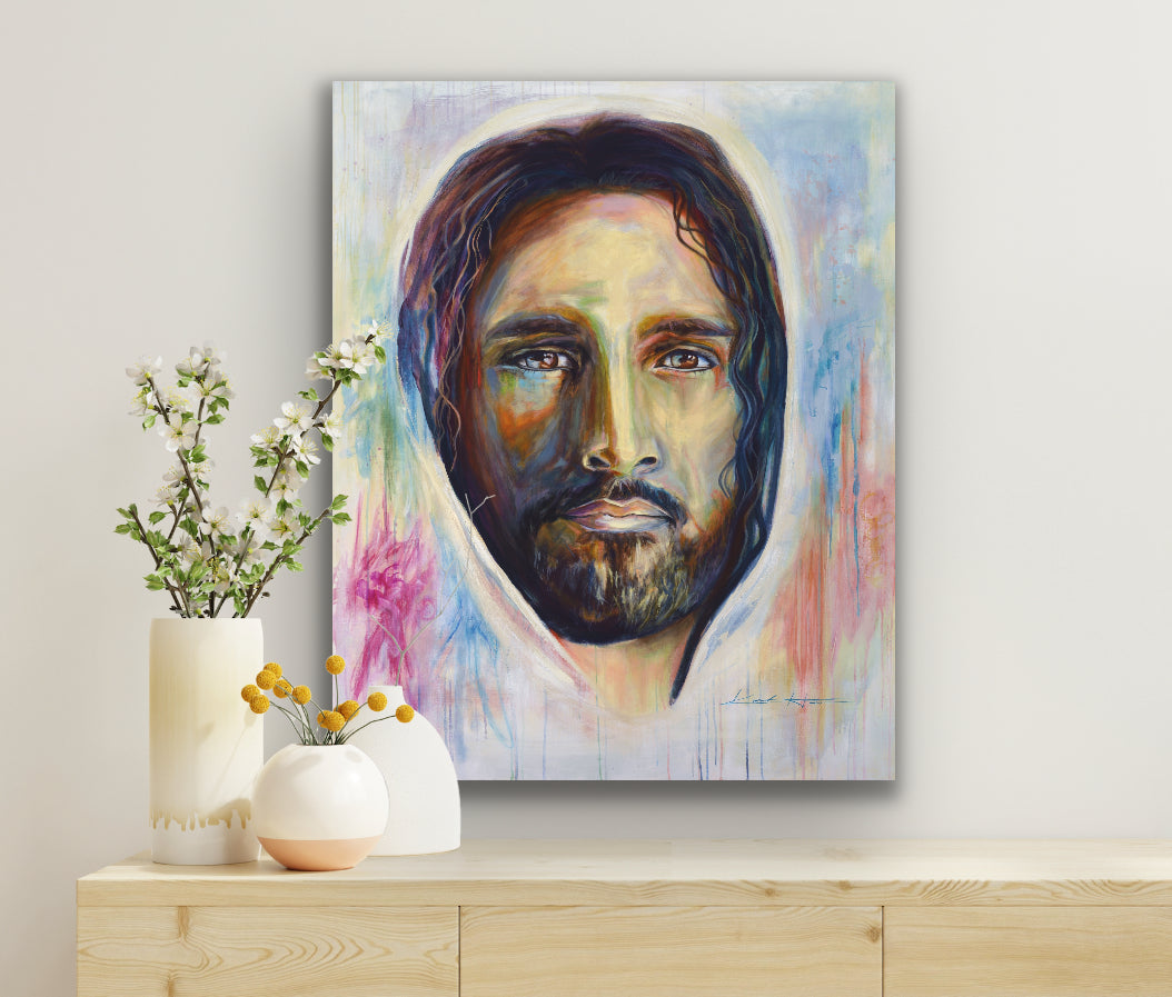 Canvas Print of Jesus Christ Portrait hanging on a wall of a modern house with vases of flowers.