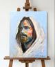 Original Oil Painting, a portrait of Jesus with big brushstrokes and thick paint, a lot of texture and vibrant colors, sitting on an easel.