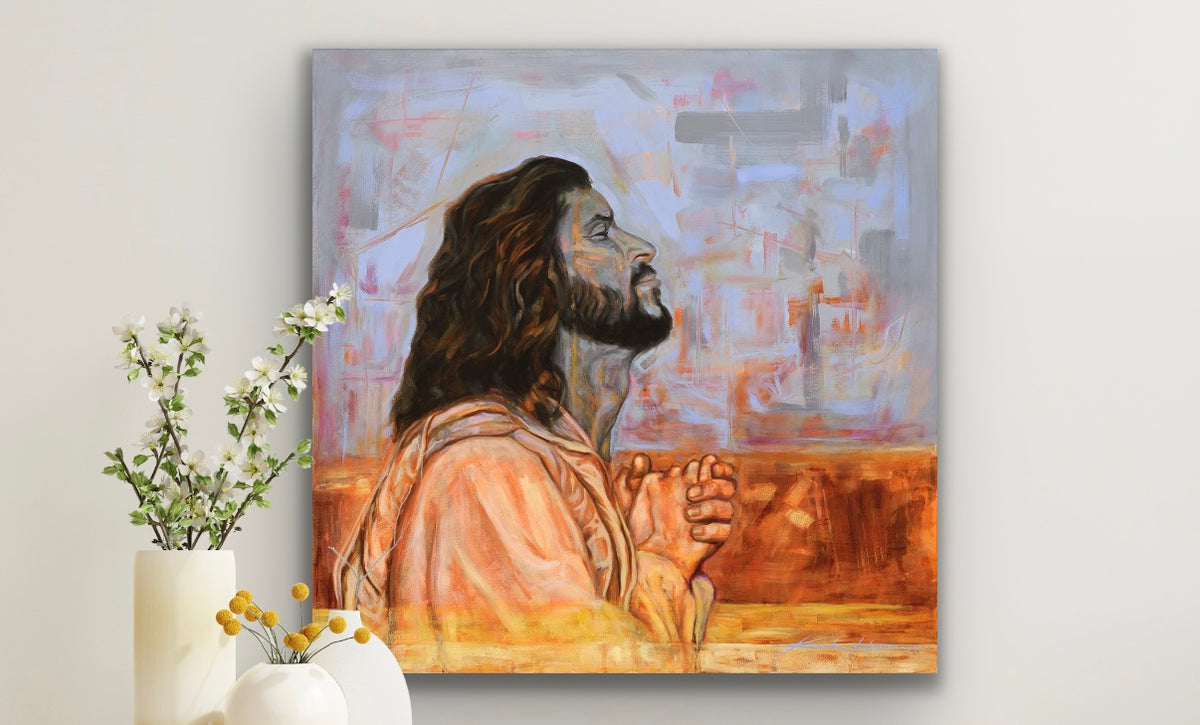 Painting of Jesus Praying for us as our advocate, Christian Wall art with flowers in a vase next to the painting. 